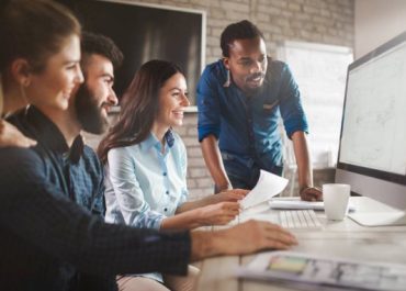 depositphotos_151257416-stock-photo-company-employees-working-in-office